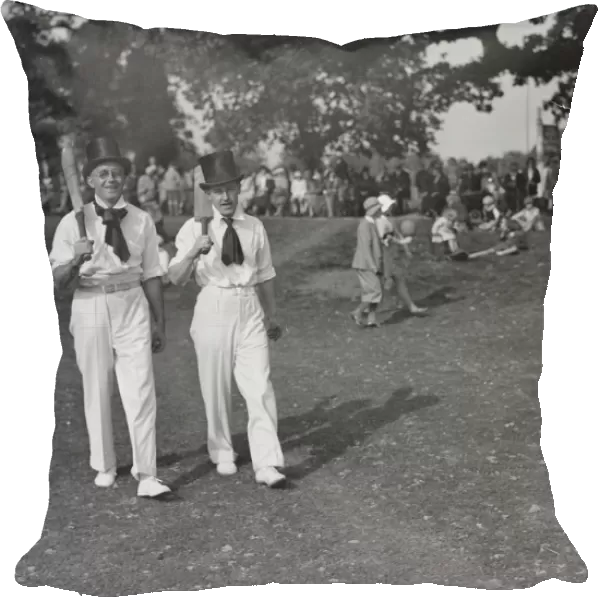 Top hats and side whiskers were worn by players in an old time cricket match between