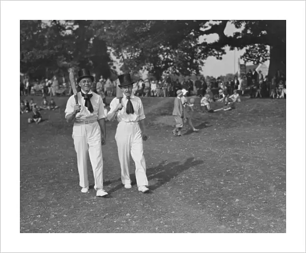 Top hats and side whiskers were worn by players in an old time cricket match between