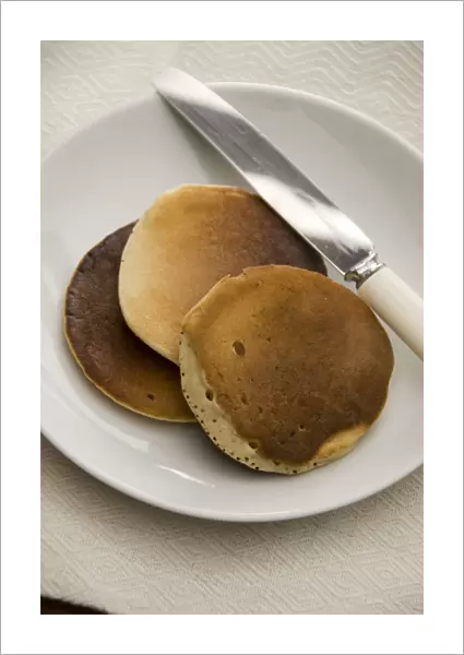 Three Scotch pancakes on a white plate. credit: Marie-Louise Avery  /  thePictureKitchen