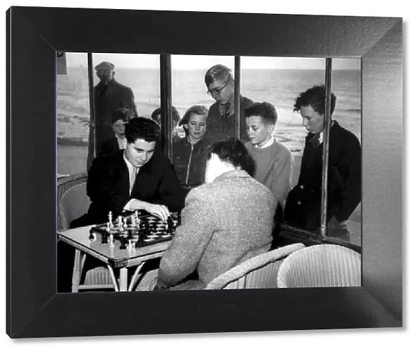 Hastings, Sussex: A group of youngsters watch through the window of the Sun Lounge