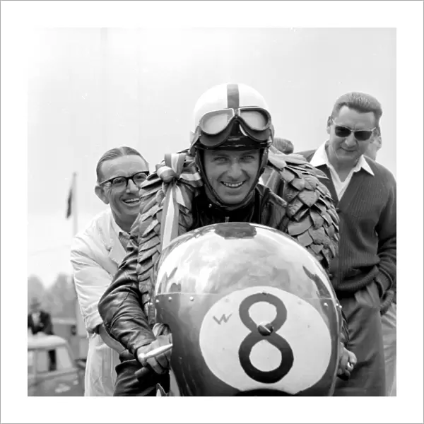 Brands Hatch, Kent: German Motor cycle racing ace, Ernst Degner has a smile of victory