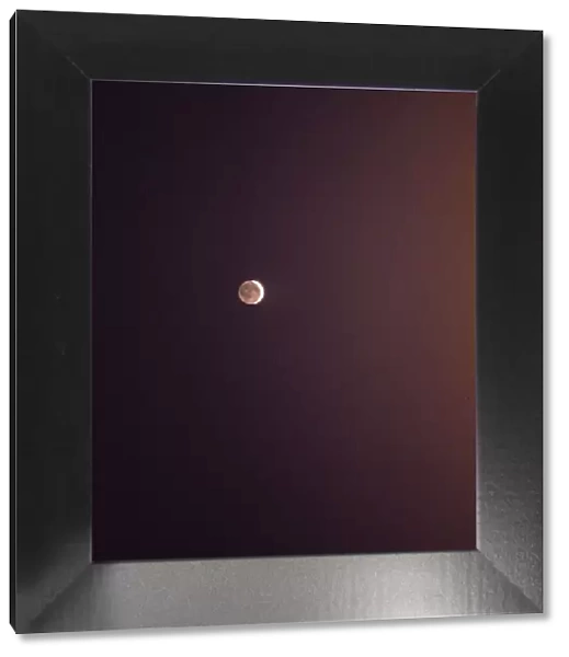 Moon in the night sky. Crescent moon with the reflection of sunlight thrown by the