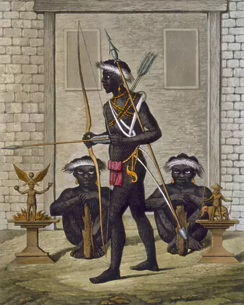 Congo tribesmen and fetish figures guard the palace of the Saba or sovereign, c