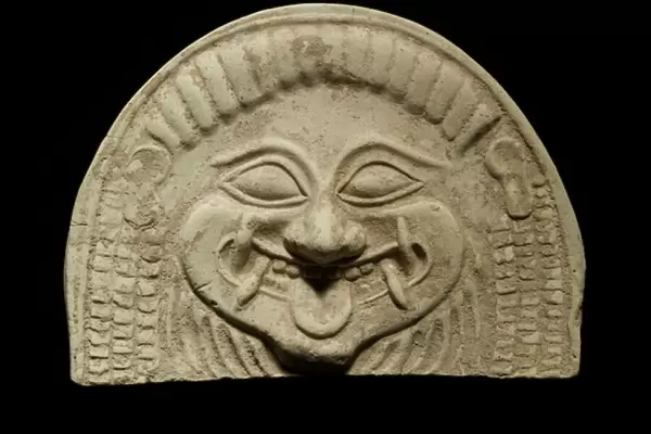 Antefix of a Gorgons head, from Tarento, c. 6th century BC (terracotta)