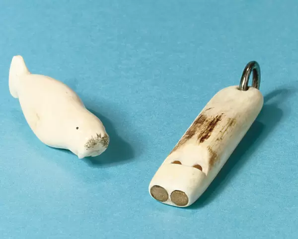 Model of a walrus and a whistle (bone)