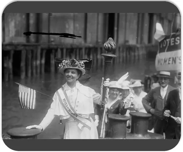 Mina van Winkle receiving the Suffrage Torch on a tugboat, 1915 (b  /  w photo)