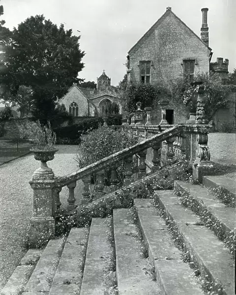 View of the church and the Priest's House from the terrace at Brympton d'Evercy, from 100 Favourite Houses (b / w photo)