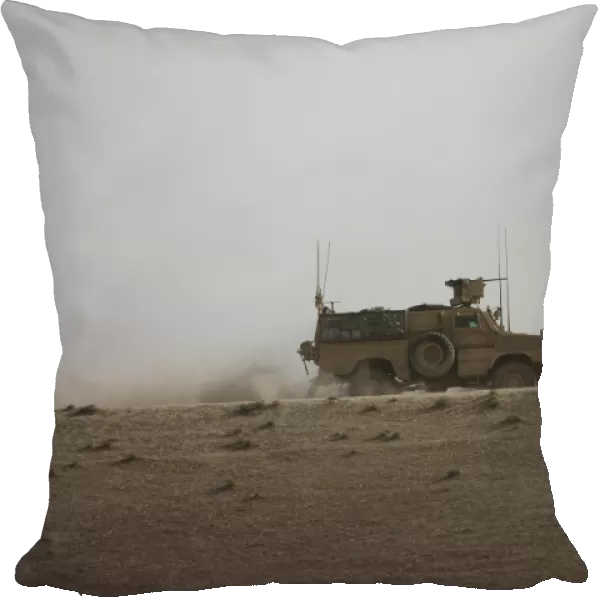 An MRAP vehicle patrols the ridge of a wadi near Kunduz, Afghnanistan