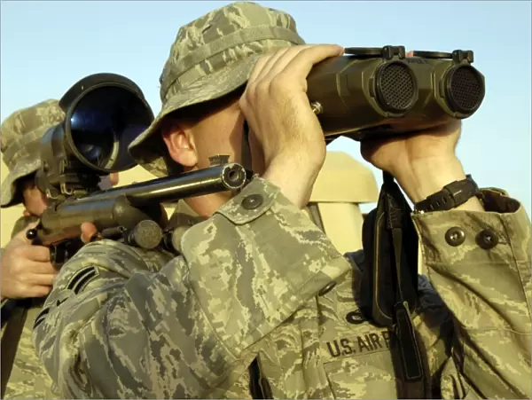 Soldiers demonstrate a buddy sniper position