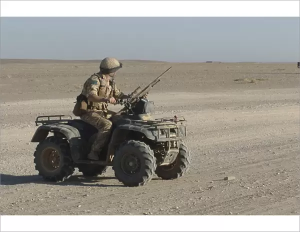 A British Army soldier provides security on a ATV