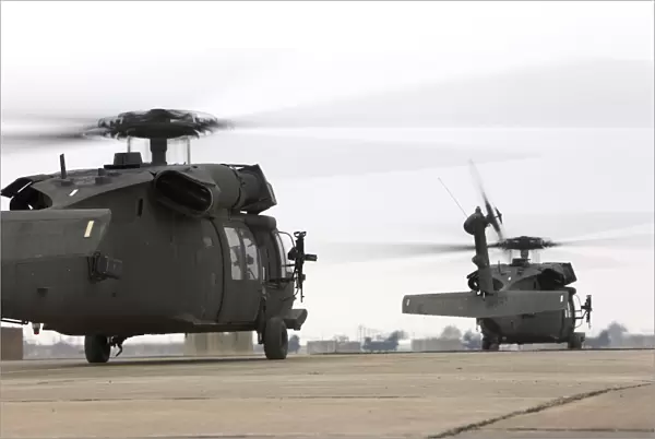 Two UH-60 Black Hawks taxi out for a mission over northern Iraq