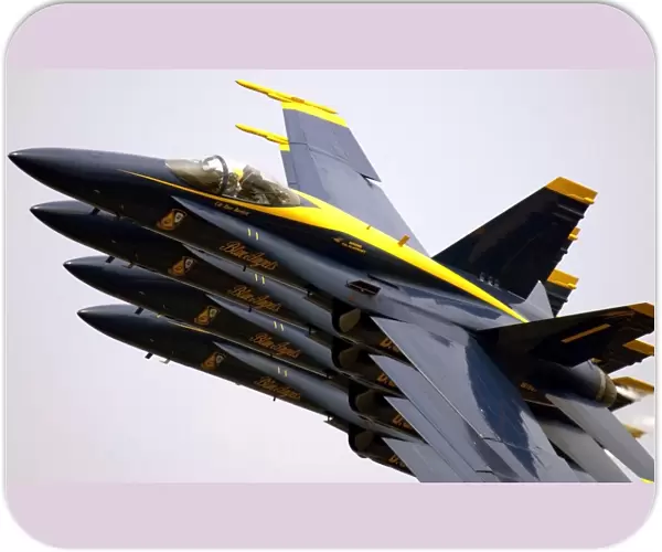 Four Blue Angels F  /  A-18C Hornets perform the Echelon Parade maneuver