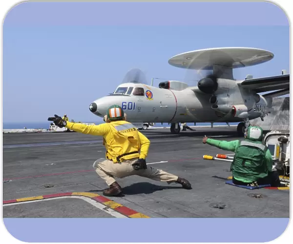 Sailors launch an E-2C Hawkeye aboard USS Dwight D. Eisenhower