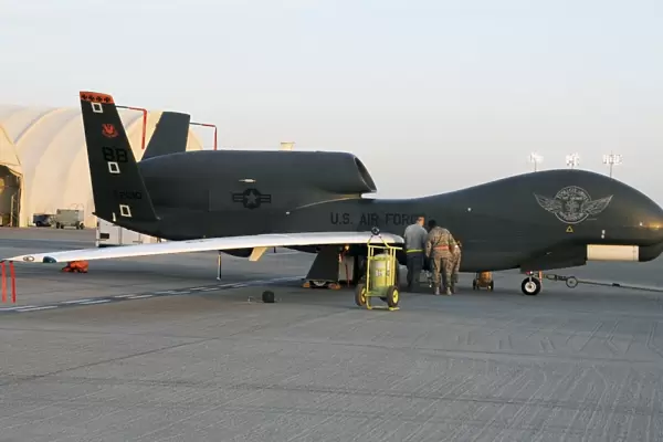 U. S. Airmen conduct preflight services on an RQ-4 Global Hawk