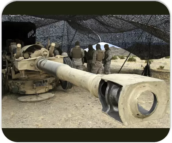 Cannoneers take advantage of some down time behind their M198 Towed Howitzer