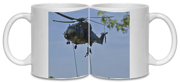 A pathfinder of the Belgian Army fast-roping from a NH90 helicopter