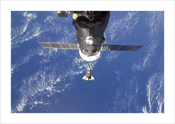 Space Shuttle Discovery approaches the International Space Station