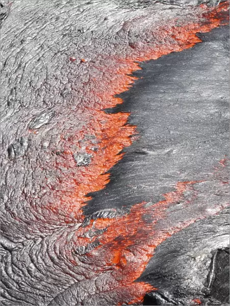 Lava flowing from under crust of lava lake, Erta Ale volcano, Danakil Depression
