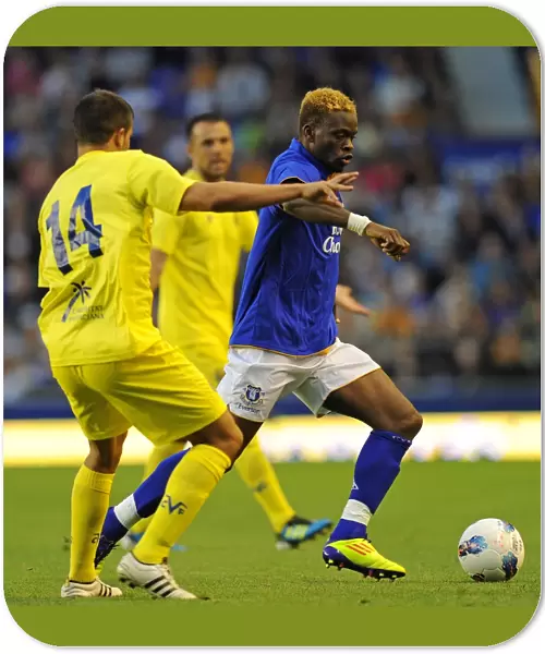 Everton's Louis Saha Battles Past Villarreal's Mario in Thrilling Pre-Season Clash at Goodison Park (05 August 2011)
