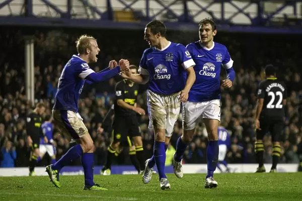 Everton's Jagielka and Naismith: Celebrating a Winning Moment at Goodison Park (26-12-2012)