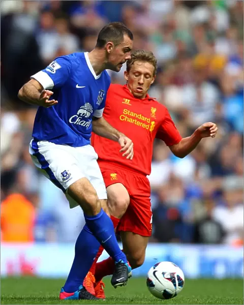 Battle for the Ball: Leiva vs. Gibson - Liverpool vs. Everton Rivalry in the Barclays Premier League (0-0)