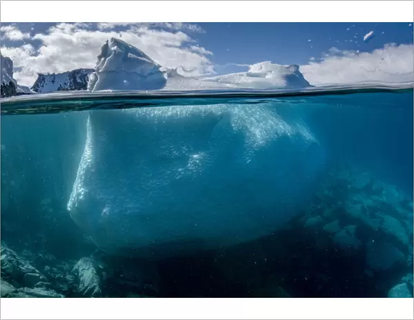 Split level view of an iceberg, Kinnes Cove, Joinville Island, Antarctica Peninsula, Southern Ocean