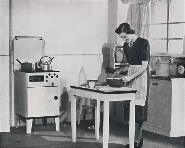 A British kitchen equipped with a cabinet gas cooker, 1942