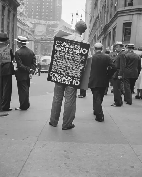 Street hawker selling Consumer s... 42nd Street and Madison Avenue, New York City, 1939. Creator: Dorothea Lange