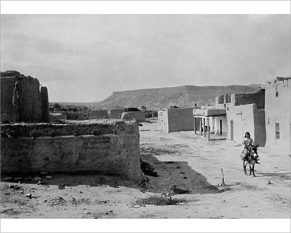 A street scene in San Ildefonso Pueblo, 1905, c1905. Creator: Edward Sheriff Curtis