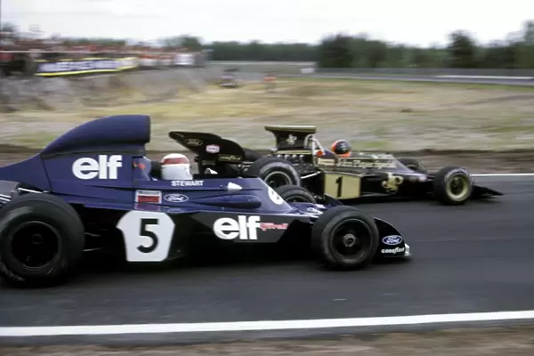 Formula One World Championship: Third placed Emerson Fittipaldi Lotus 72D holds off the race winner Jackie Stewart Tyrrell 006  /  2 as they approach