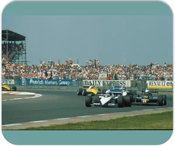 Formula One World Championship: Riccardo Patrese leads the Lotus of Elio de Angelis and the second Brabham of Nelson Piquet