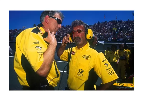 Formula One World Championship: Eddie Jordan Boss of Jordan GP chats with an engineer