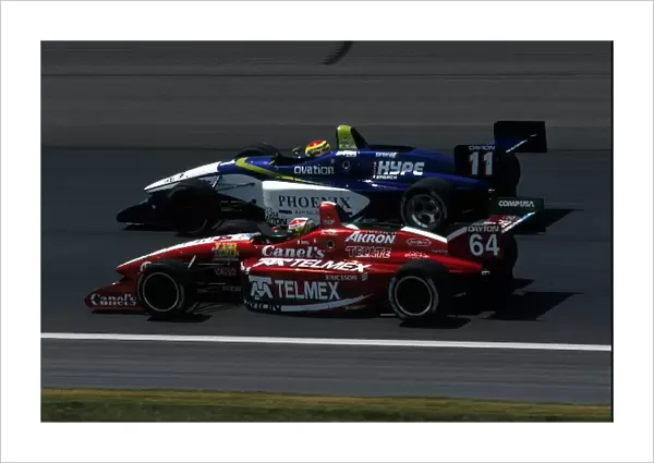 Indy Lights Series: Kristian Kolby, car 11, overtakes Ronaldo Quintanilla, car 64, and eventually won the race
