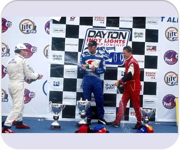 Dayton Indy Lights: Race winner Townsend Bell celebrates with 2nd place Mario Dominguez, left, and 3rd place Daniel Wheldon, right
