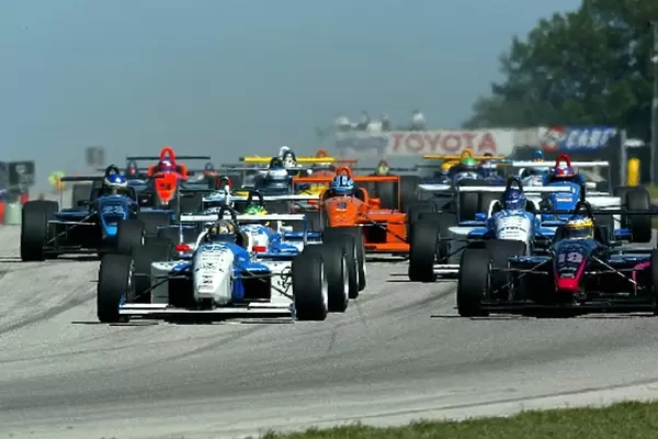 Second placed Jon Fogarty (USA) Dorricott Racing (Left) and fourth placed Michael Valiante Lynx Racing (CAN) lead at the start of the race Toyota Atlantic Championship, Road America, Elkhart Lake, Wisconsin, 18 August 2002 DIGITAL