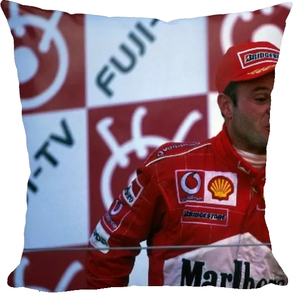 Formula One World Championship: Second placed Rubens Barrichello Ferrari celebrates on the podium