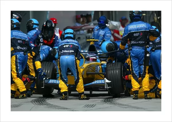 Formula One World Championship: Fourth placed Jarno Trulli Renault R23 makes a pit stop