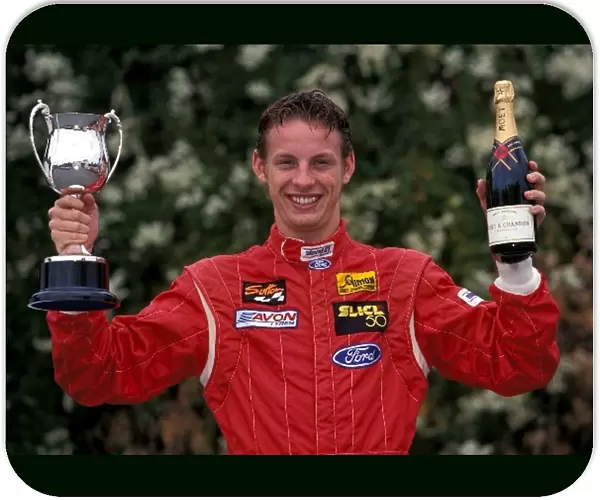 Jenson Button Photo Shoot: Formula Ford driver Jenson Button with a trophy and champagne