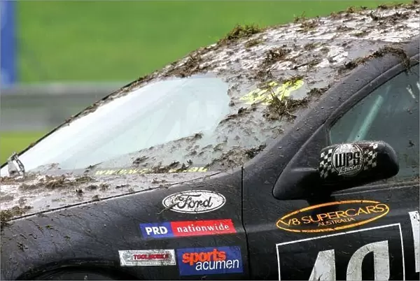 04av810. John McIntyre (NZL) WPS Ford with a mud covered windscreen.
