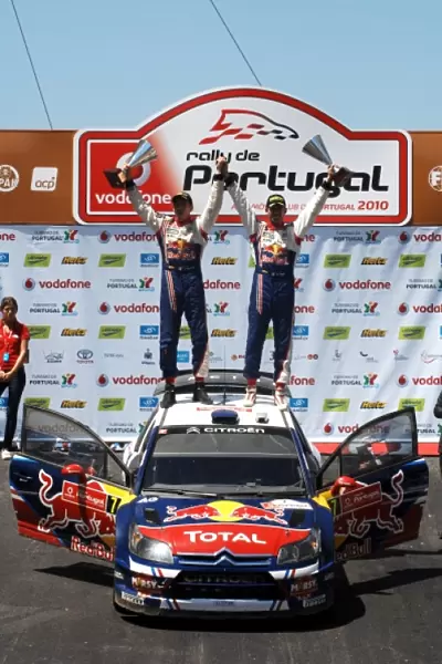 2010 FIA World Rally Championship: R-L: Sebastien Ogier and Julien Ingrassia Citroen on the podium in the Estadio Algarve