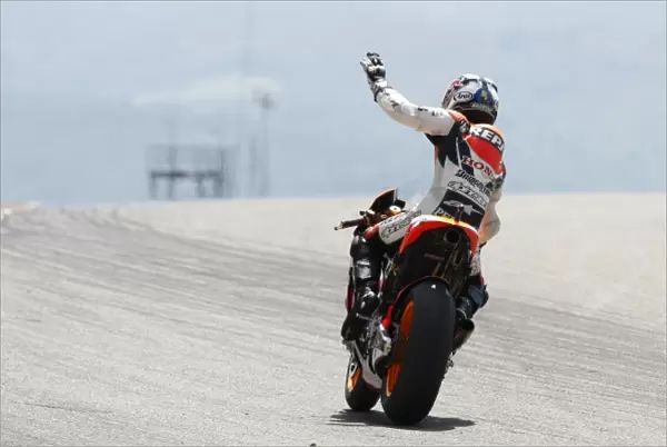 MotoGP: Race winner Dani Pedrosa, Repsol Honda Team, waves to the crowd