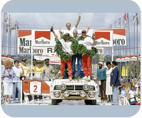 Safari Rally, Kenya. 29 March-2 April 1986: Bjorn Waldegaard  /  Fred Gallagher, 1st position. On the podium with Henry Liddon and Ove Andersson