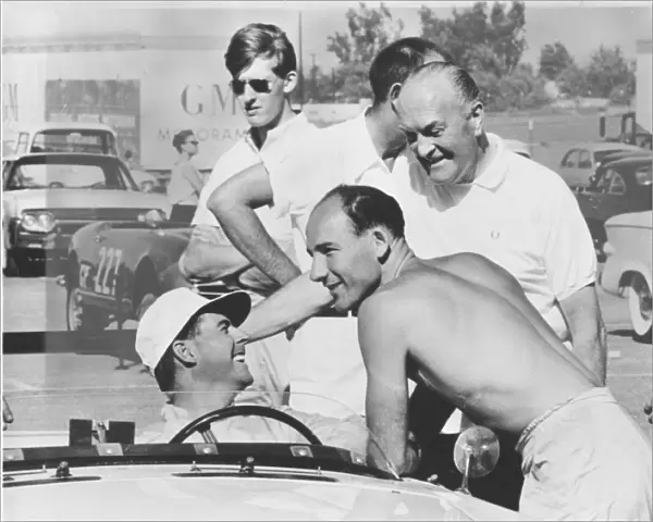 1961 3 hour Production Car Race: Stirling Moss  /  Jack Brabham, 3rd position, chat in the pits, portrait