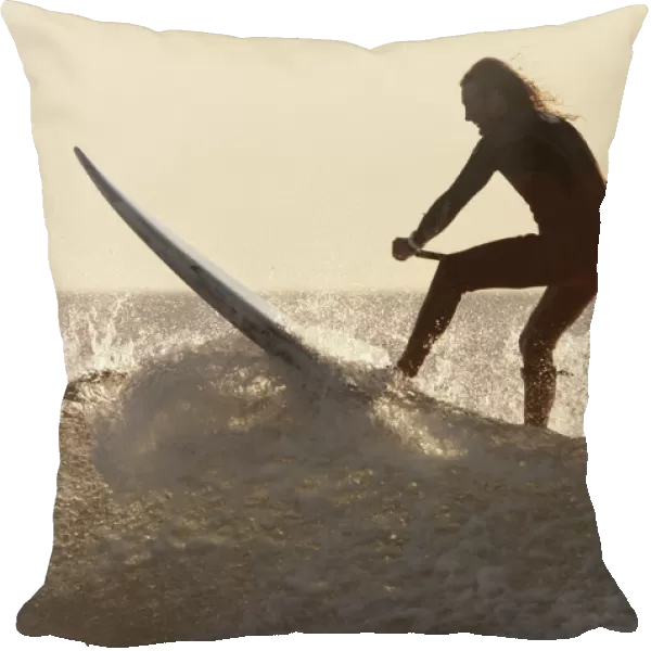 A Surfer Paddling On A Surfboard Off Benavides Beach; Tarifa Costa De La Luz Cadiz Andalusia Spain