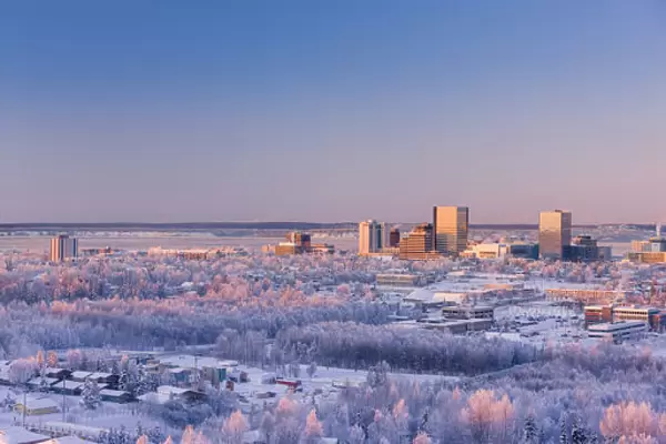 Aerial View Of Downtown Anchorage At Sunset, Hoarfrost On The Trees, Alpenglow On Mount Susitna, Winter, Anchorage, Southcentral Alaska, Usa