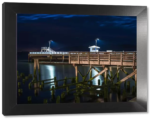 17th Street Pier Is Illuminated On A Summer Evening; Astoria, Oregon, United States Of America