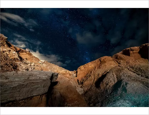 Stars in the night sky above a rocky ravine in the Atacama Desert, San Pedro De Atacama, Chile