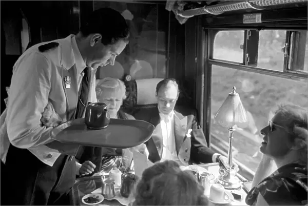 Opera goers express to Glynbourne British Rail waiter serves tea in the Buffet car