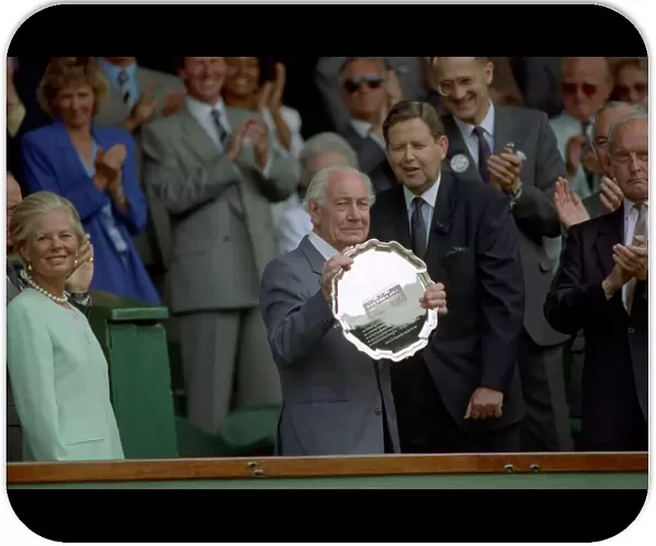 Former player and commentator Don Maskell receives a trophy from the Duchess of Kent at
