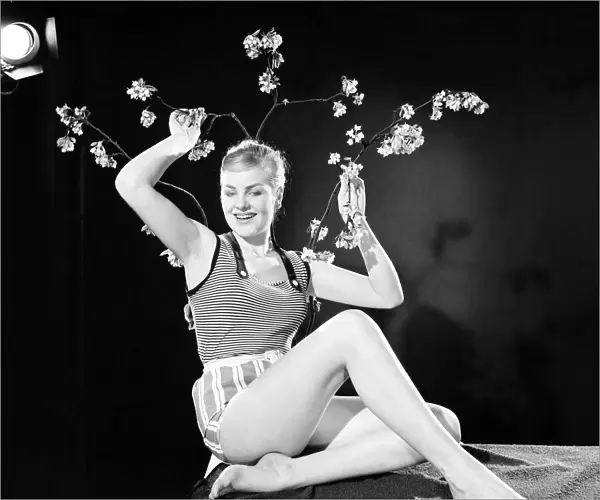 Ruth Calvert seen here modelling the latest 1959 springtime fashions posing with blossom